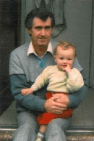 An image of James Spencer holding his daughter 